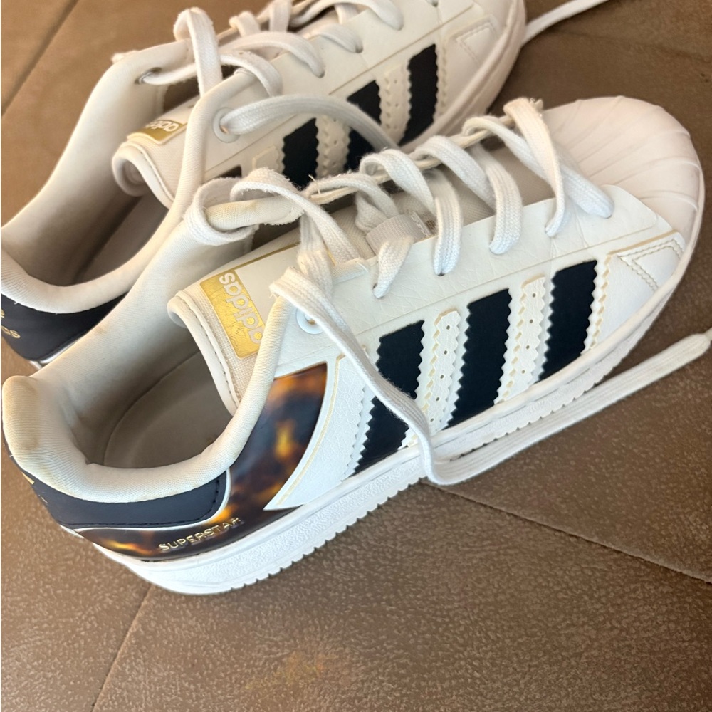 adidas Kids White Sneakers with Black Stripes and Gold Accent
